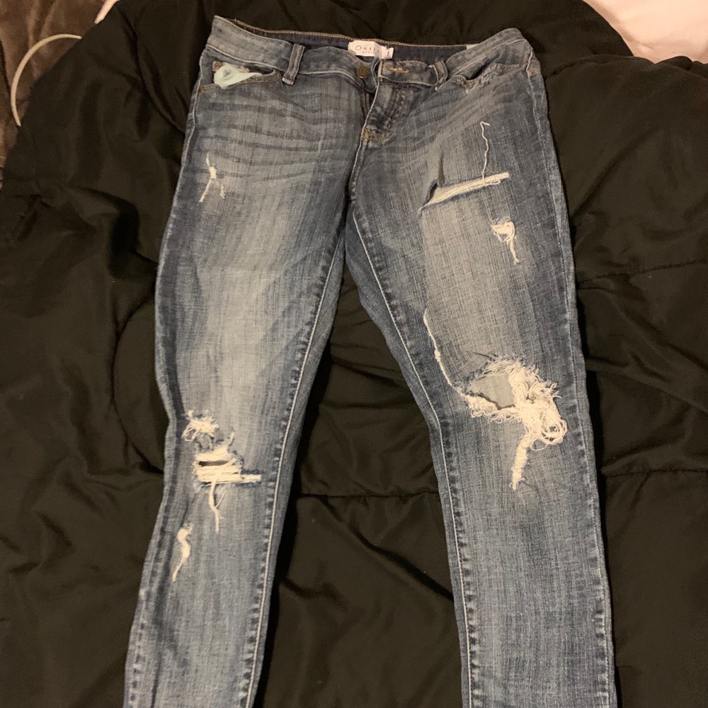 Distressed blue jeans size 4